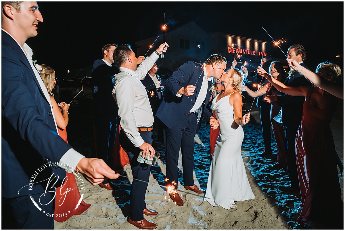 Wedding Photography by Bokeh Love Photography, end of night image with bride and groom running through sparklers