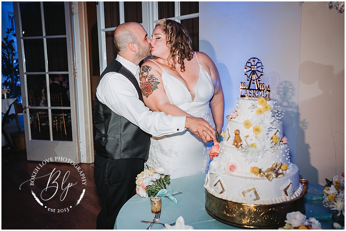 Photography by Bokeh Love Photography, wedding reception photos at the flanders hotel in ocean city, bride and groom cut the wedding cake