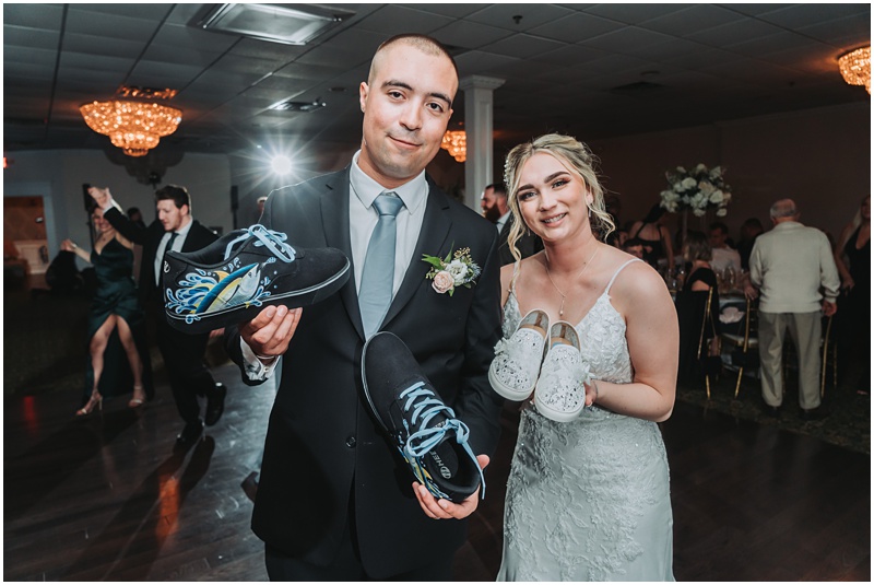 Professional Wedding Photo by Bokeh Love Photography, The Bradford Estate, bride and groom doing the shoe game with custom designed shoes