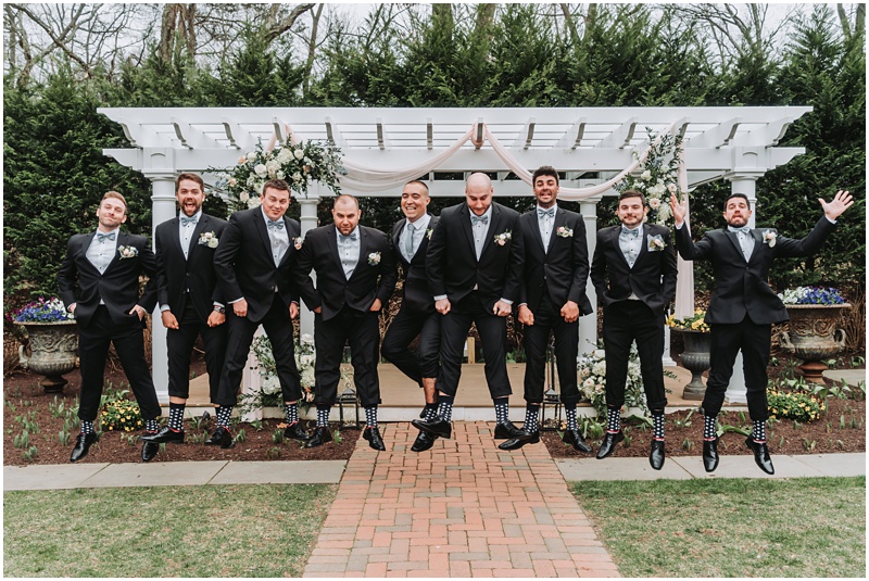 Professional Wedding Photo by Bokeh Love Photography, A Springtime Wedding at The Bradford Estate, groomsmen jumping at the bradford estate, getting serious height in fancy shoes