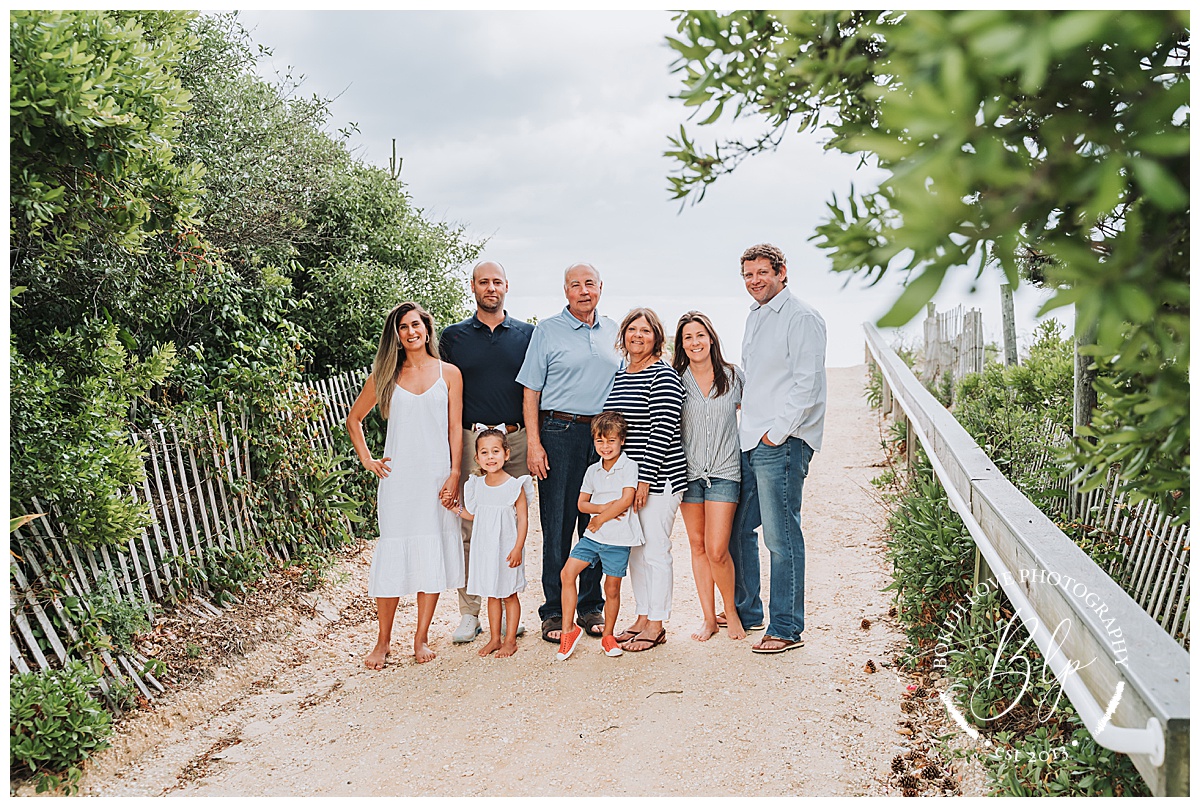 Photo by Bokeh Love Photography, extended family together on the beach for a family portrait in LBI new jersey, Extended Family Beach Session 