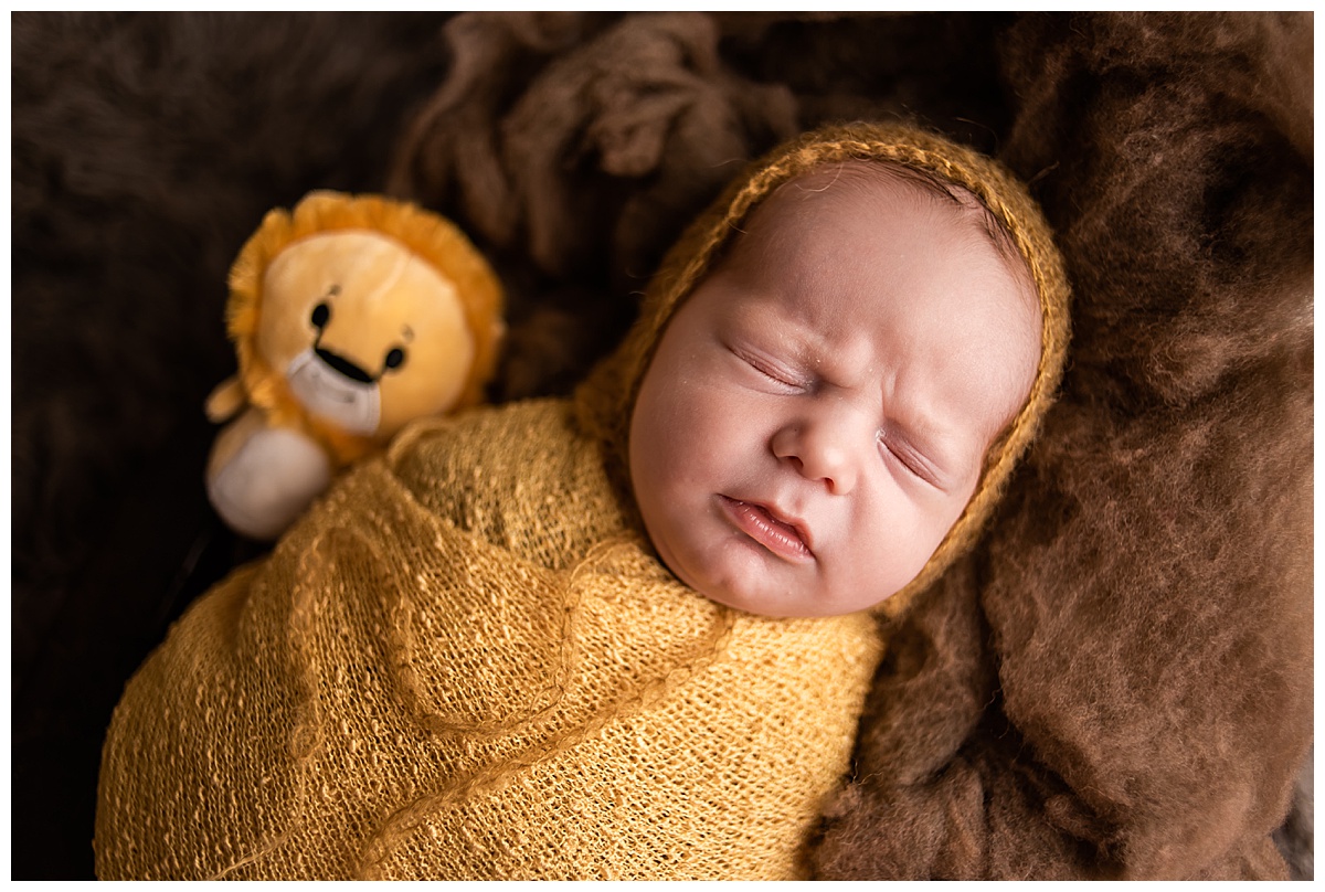 Newborn Session with Family Portraits before session. Beautiful baby boy in a yellow wrap, Photographs by Bokeh Love Photography.